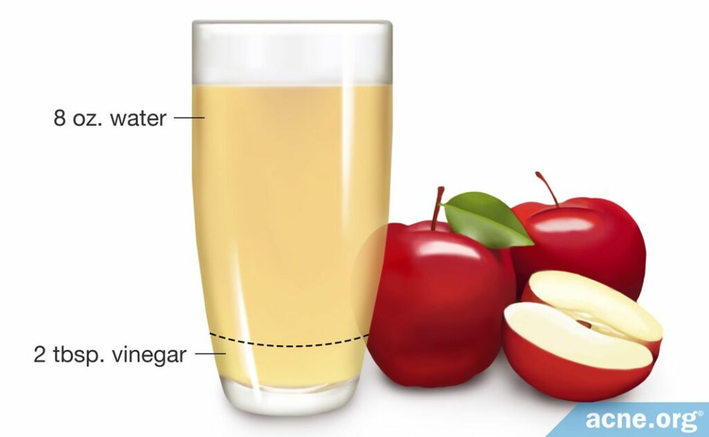 Apples Next to Apple Cider Vinegar in Glass